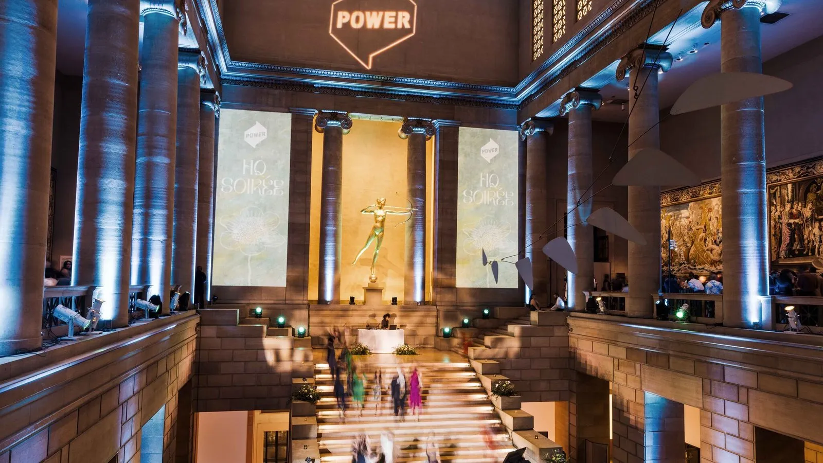The Great Stair Hall during HQ Soirée, the vertical loops on the pillars either side of the gilded huntress