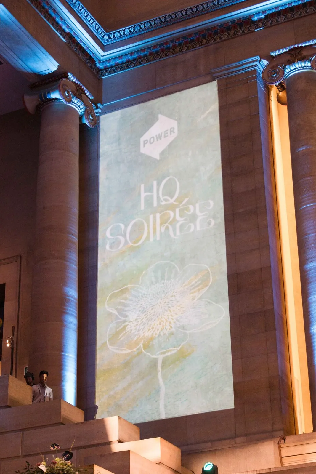 HQ Soiree projected full height on a pillar beside the stairs
