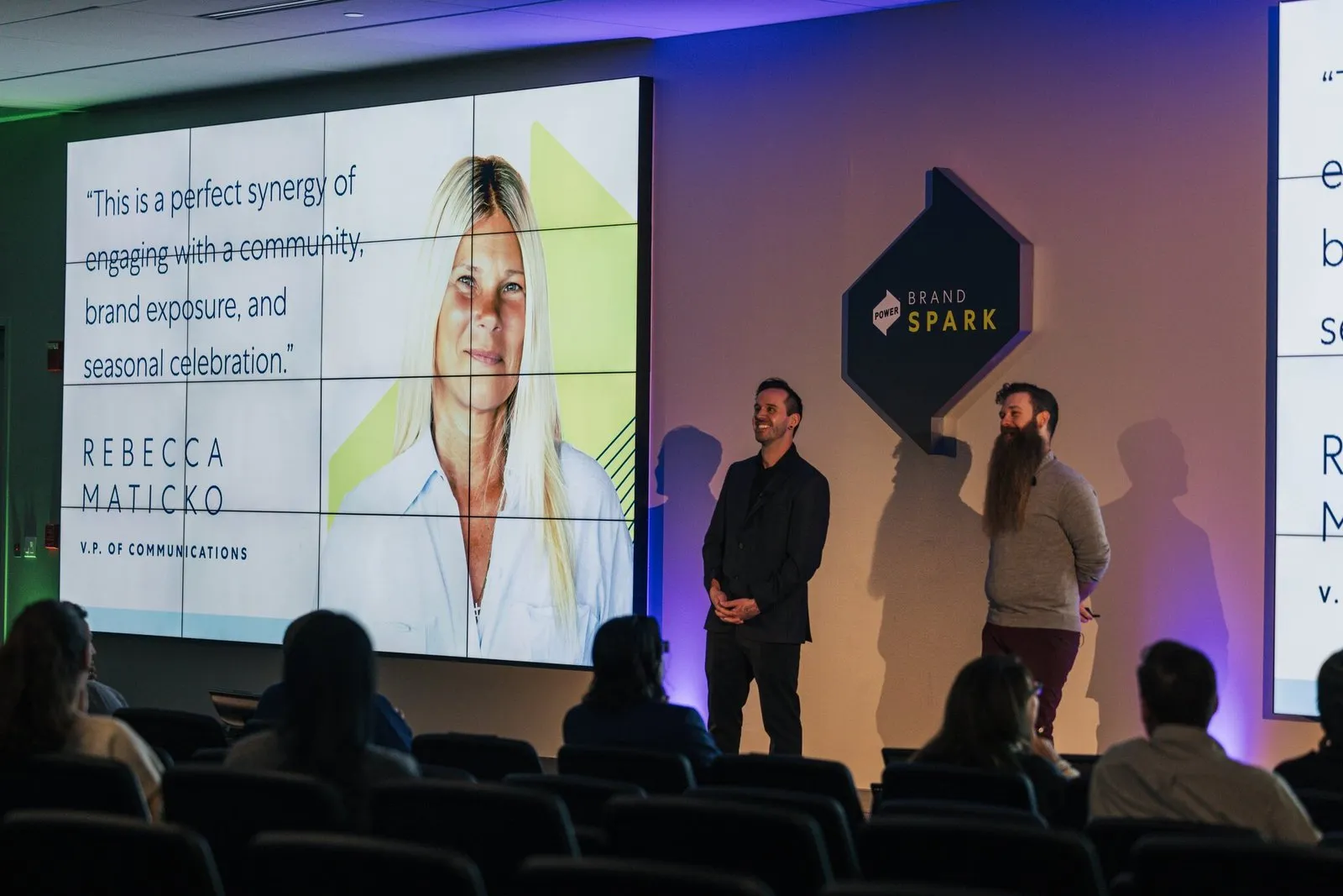 Matt and Adam on stage with the community quote slide